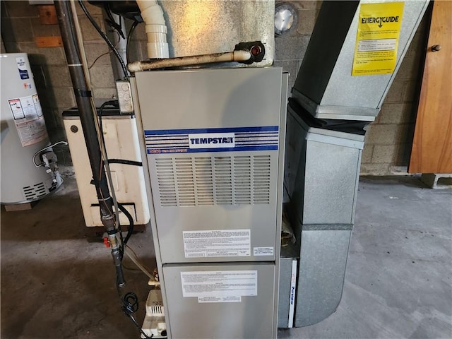 utility room featuring gas water heater