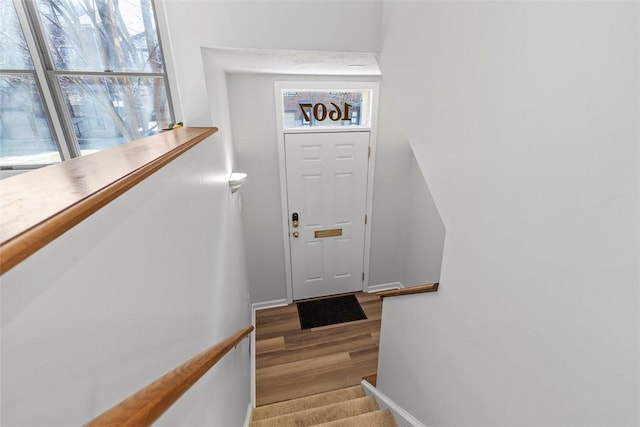 staircase featuring hardwood / wood-style flooring