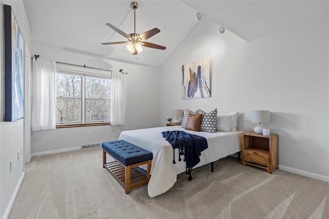 carpeted bedroom with lofted ceiling and ceiling fan