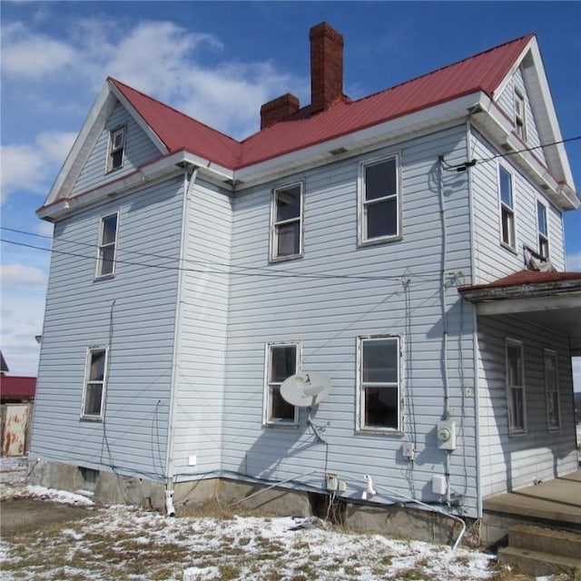 view of snow covered house