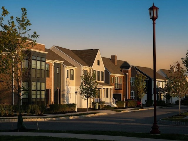 view of outdoor building at dusk