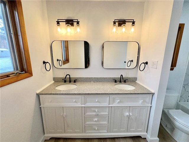 302 S Main St, Masontown, PA 15461 - full bathroom with toilet, double vanity, and baseboards