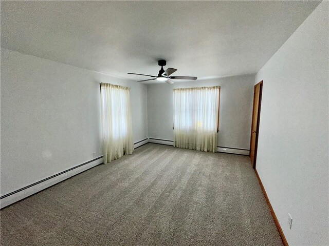 302 S Main St, Masontown, PA 15461 - spare room with healthy amount of natural light, light colored carpet, a baseboard heating unit, and a ceiling fan