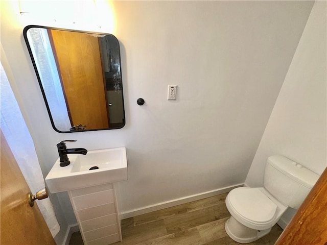 302 S Main St, Masontown, PA 15461 - bathroom with wood finished floors, toilet, and baseboards