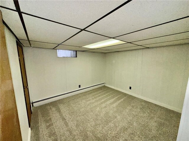 302 S Main St, Masontown, PA 15461 - basement with baseboard heating, carpet, a paneled ceiling, and baseboards