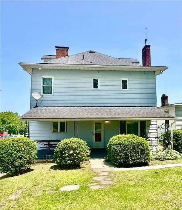 302 S Main St, Masontown, PA 15461 - rear view of property featuring a lawn and a chimney