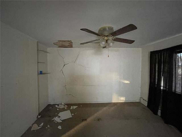 unfurnished room with baseboard heating and ceiling fan