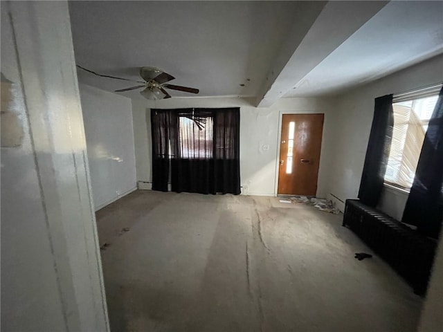 foyer entrance with ceiling fan