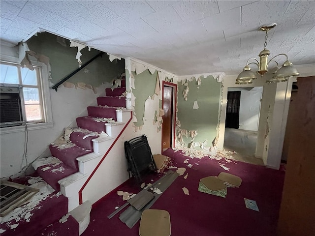 basement featuring an inviting chandelier