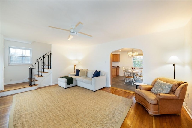 living room featuring ceiling fan and wood-type flooring