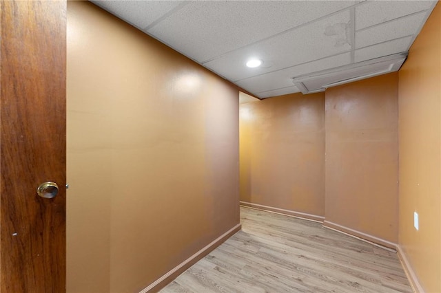 interior space with light hardwood / wood-style floors and a paneled ceiling