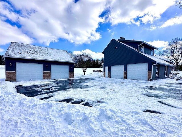 view of snow covered garage