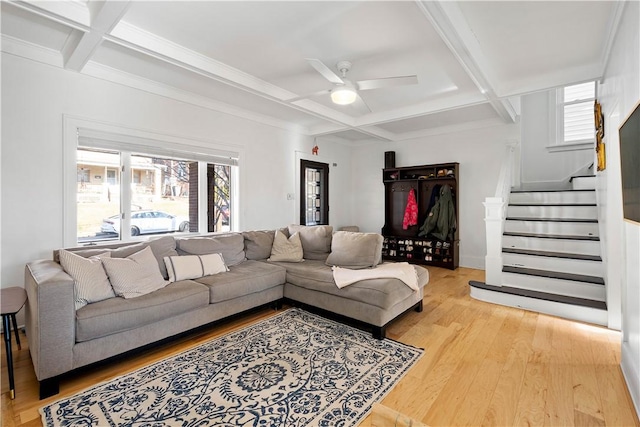 living room with coffered ceiling, hardwood / wood-style flooring, ceiling fan, and beam ceiling