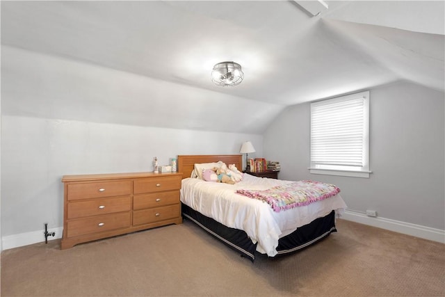 bedroom with light carpet and vaulted ceiling