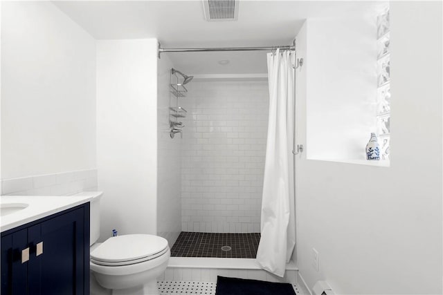 bathroom featuring vanity, a shower with curtain, and toilet