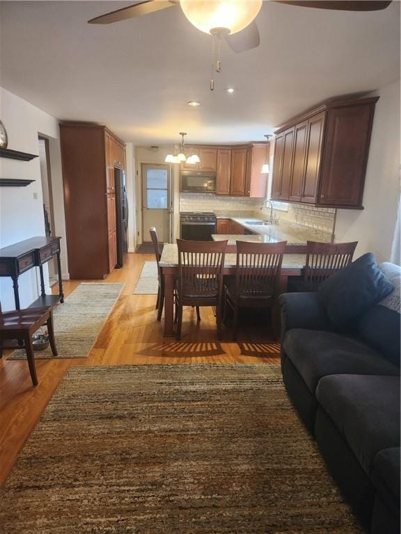 interior space featuring light wood-style floors and a ceiling fan