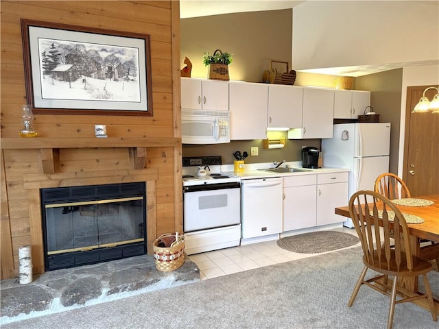 Z1 Sunridge Dr, Seven Springs Resort, PA 15622 - kitchen with white cabinetry, a fireplace, sink, white appliances, and light tile patterned floors