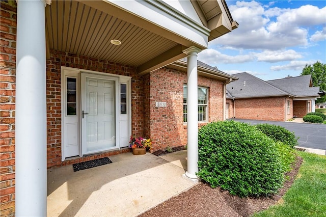 doorway to property featuring covered porch