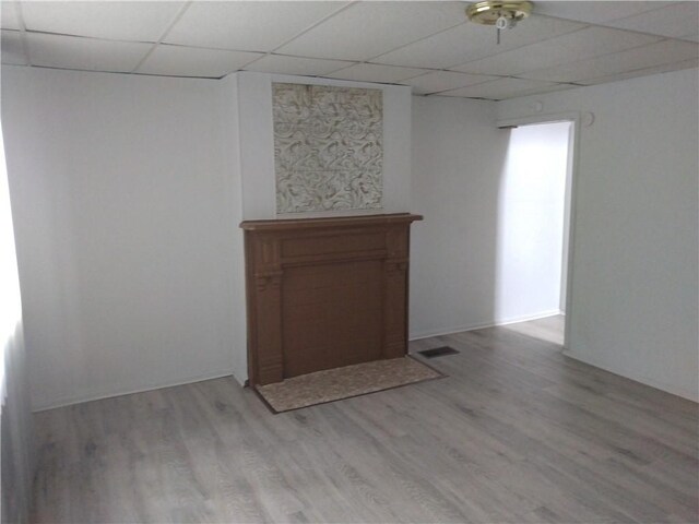 1405-1407 W W, Homestead, PA 15120 - empty room with a paneled ceiling and light wood-style flooring