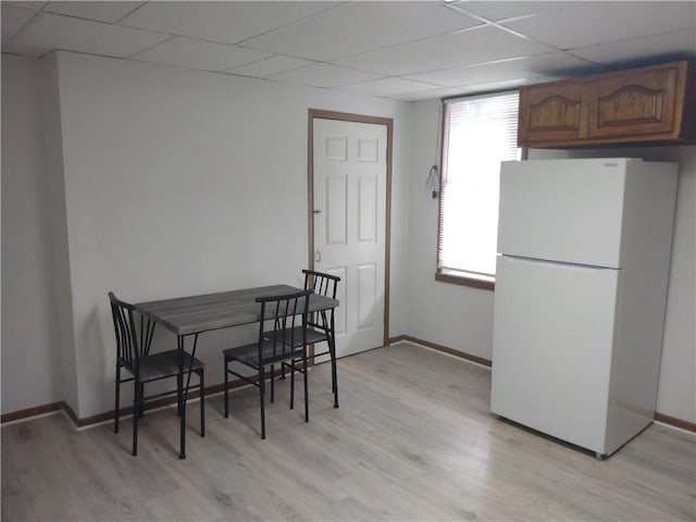1405-1407 W W, Homestead, PA 15120 - dining room featuring a paneled ceiling, light wood finished floors, and baseboards
