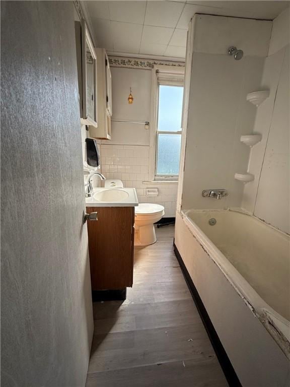 1405-1407 W W, Homestead, PA 15120 - bathroom featuring vanity, wood finished floors, shower / bath combination, and tile walls