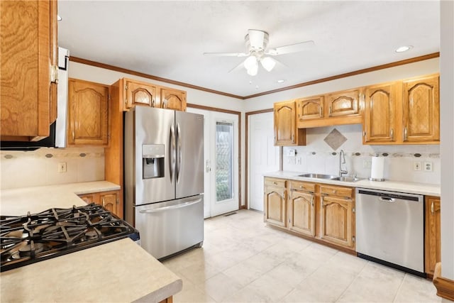 kitchen featuring ornamental molding, sink, stainless steel appliances, and backsplash