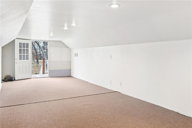 bonus room featuring carpet flooring and lofted ceiling