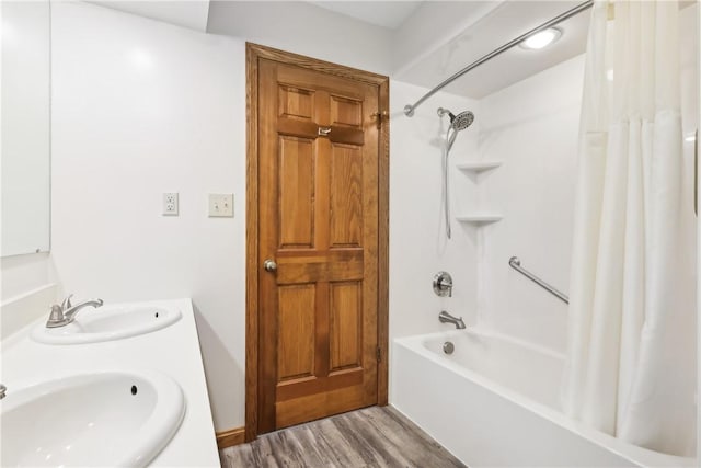 bathroom featuring shower / tub combo with curtain, vanity, and hardwood / wood-style floors