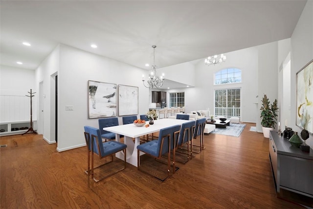 dining room featuring baseboards, a chandelier, wood finished floors, and recessed lighting