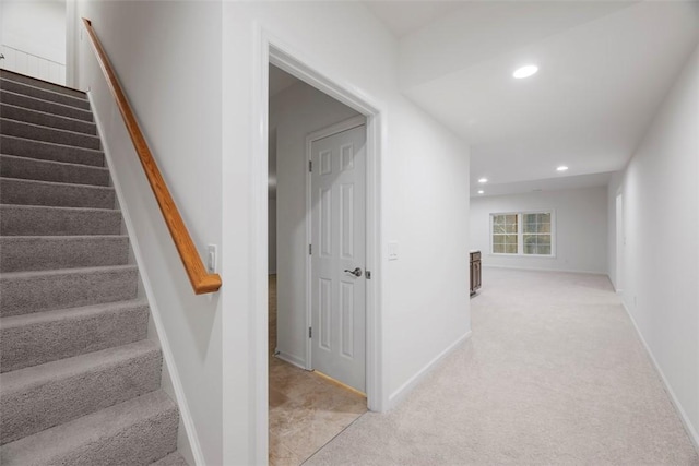 staircase featuring baseboards, carpet flooring, and recessed lighting