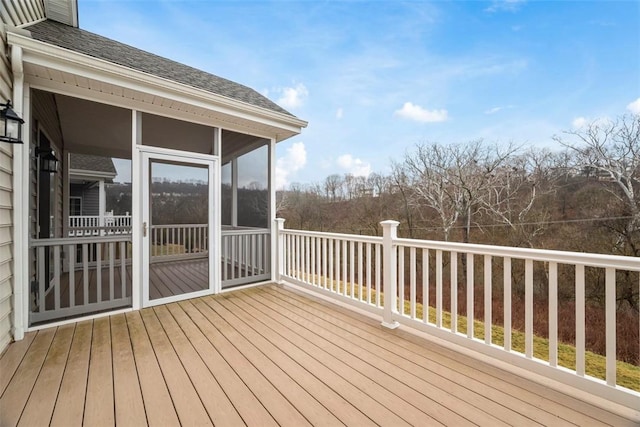 wooden terrace featuring a sunroom