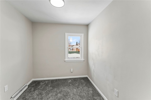 carpeted empty room with a baseboard radiator