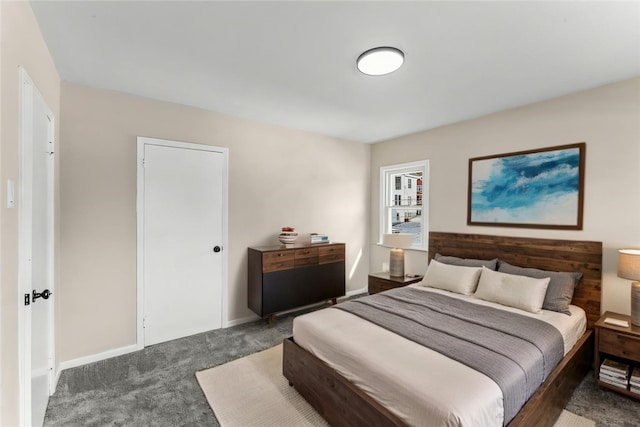 bedroom featuring dark colored carpet