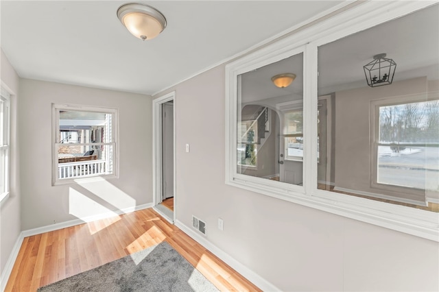 spare room with wood-type flooring