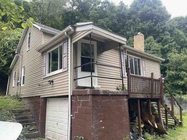 view of property exterior with a garage