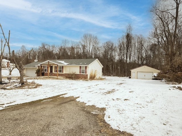 view of front of home with an outdoor structure and a garage