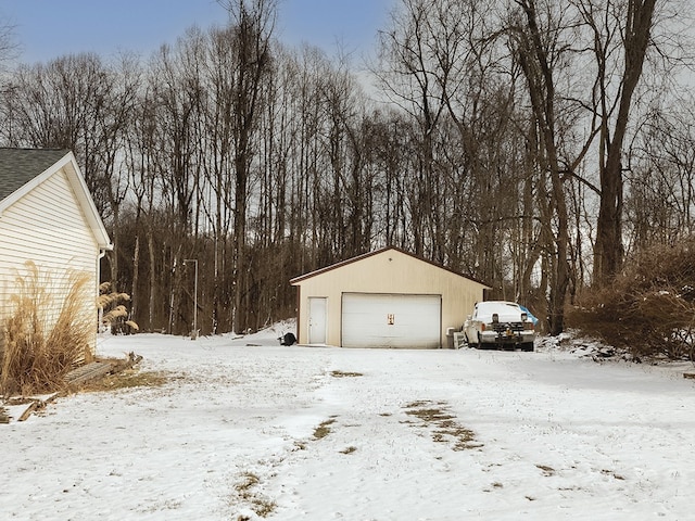 view of snow covered garage