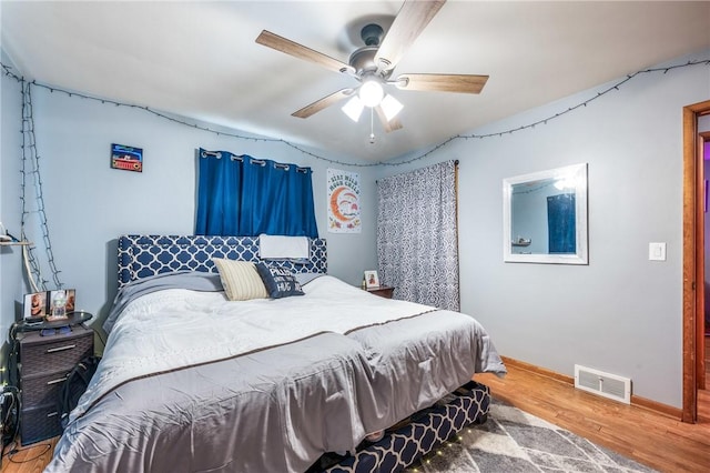 bedroom featuring ceiling fan and wood-type flooring