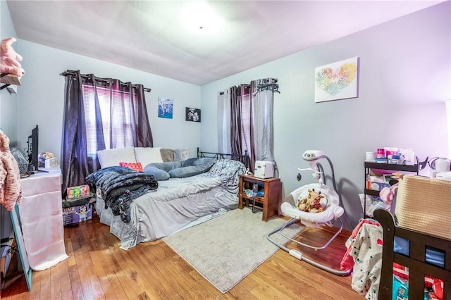 bedroom featuring wood-type flooring