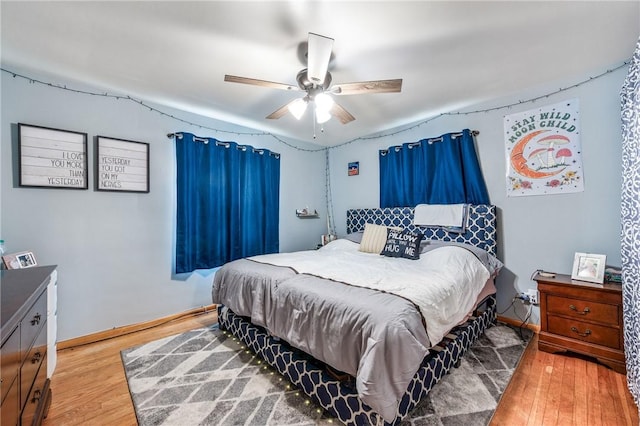 bedroom featuring ceiling fan and hardwood / wood-style floors