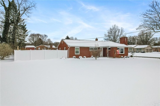 view of snow covered house