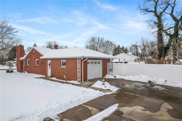 view of snow covered garage