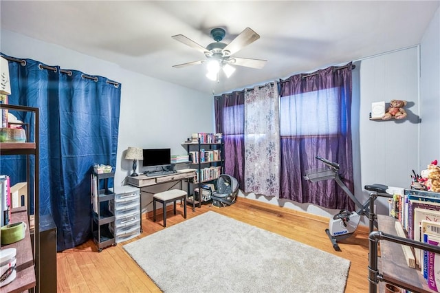 office space with hardwood / wood-style flooring and ceiling fan