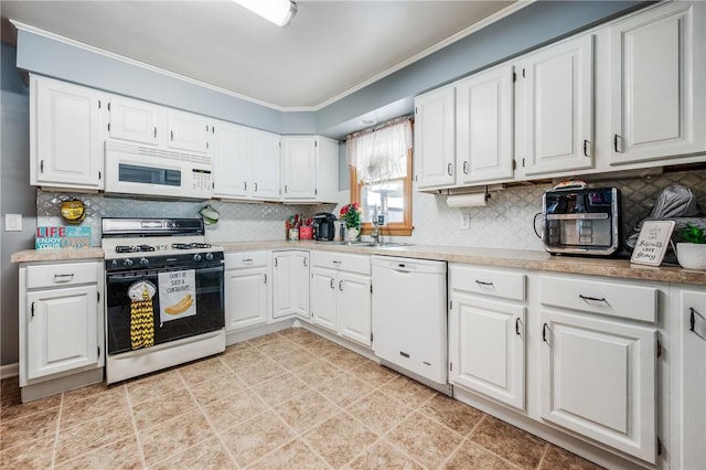 kitchen with white appliances, white cabinetry, and backsplash