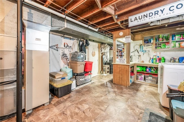 storage room featuring washer / clothes dryer