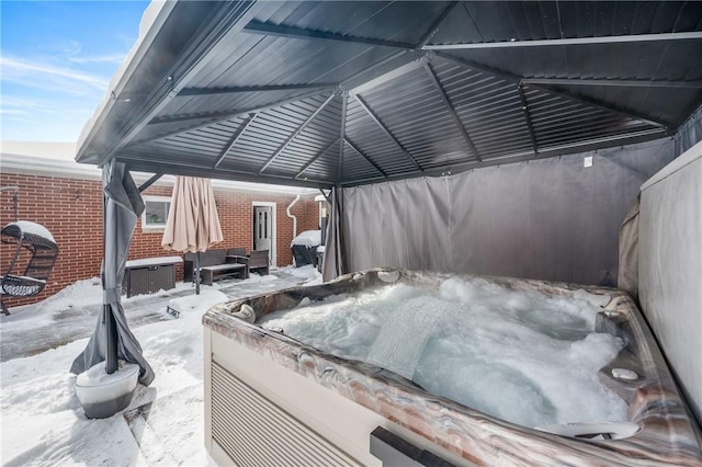 view of patio / terrace with a hot tub