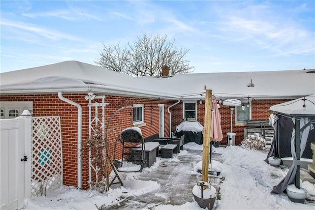 view of snow covered house