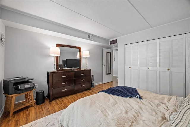 bedroom featuring light hardwood / wood-style floors and a closet