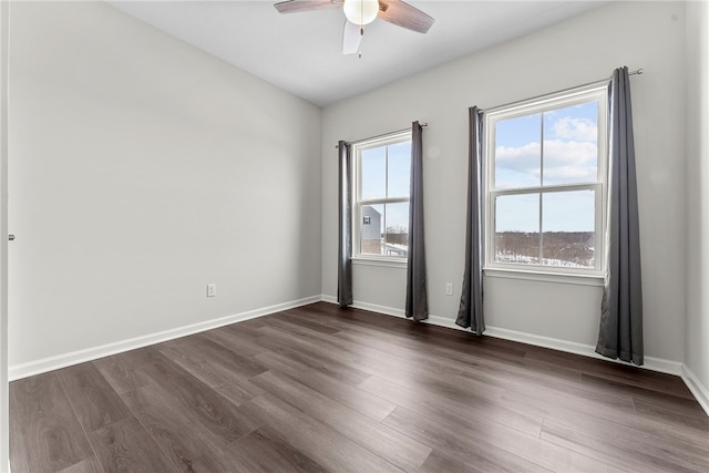 unfurnished room featuring dark hardwood / wood-style flooring and ceiling fan