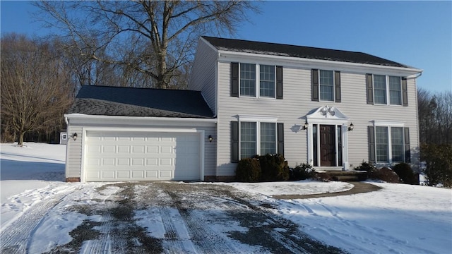 colonial home featuring a garage